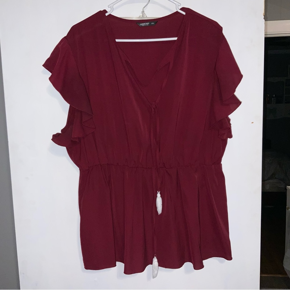 Dark red top with tassel strings and ruffle sleeves